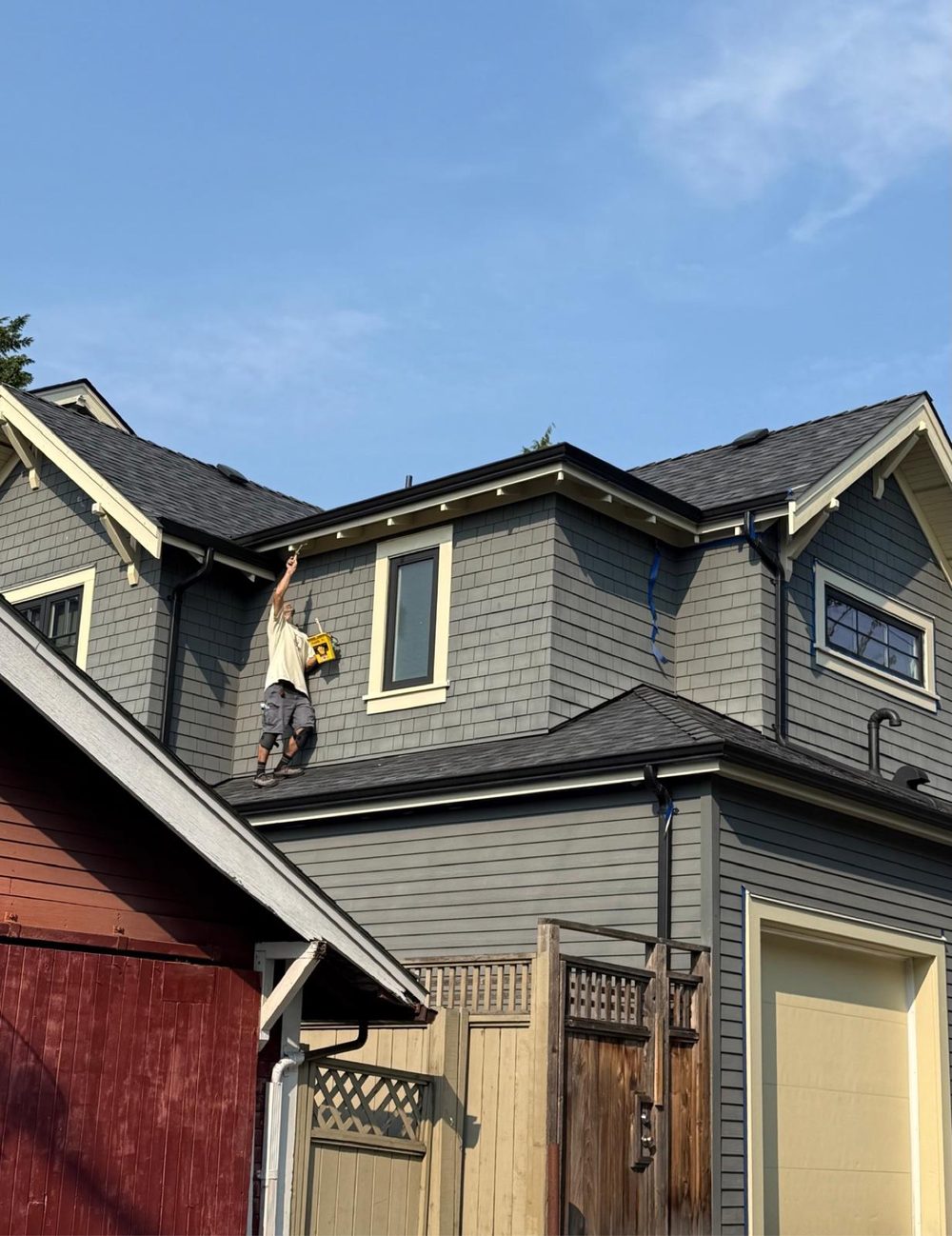 Farhad Contracting painting exterior eaves on a residential home